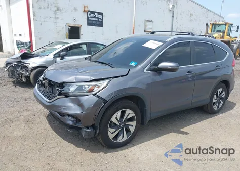 2015 Honda Cr-V Touring z USA, uszkodzony, nr VIN 5J6RM4H97FL125455